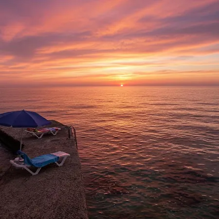 Sunset Seafront With Infinity Pool