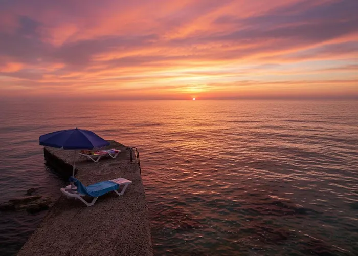 Sunset Seafront With Infinity Pool
